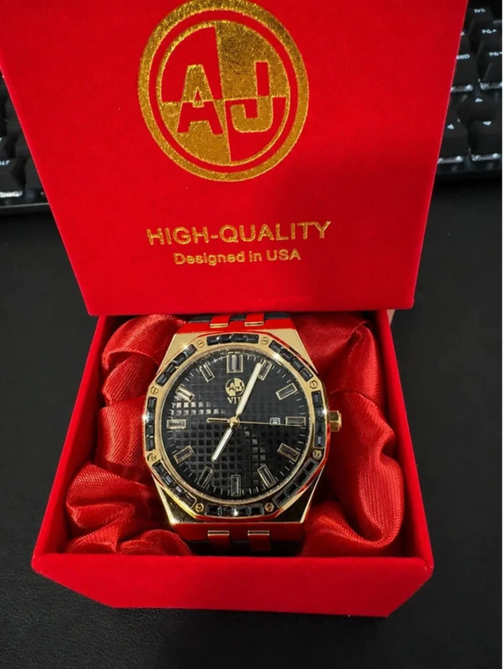 #653  43mm AJ Gold-Tone Statement Watch – Black Crystal Bezel